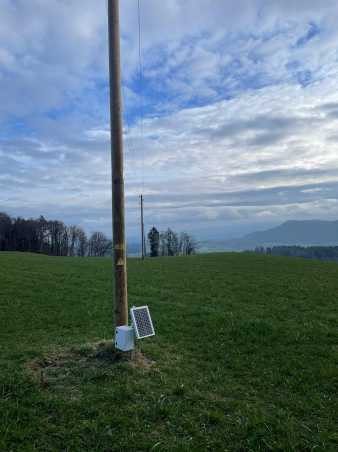 Small meteo station attached on a wooden power pole
