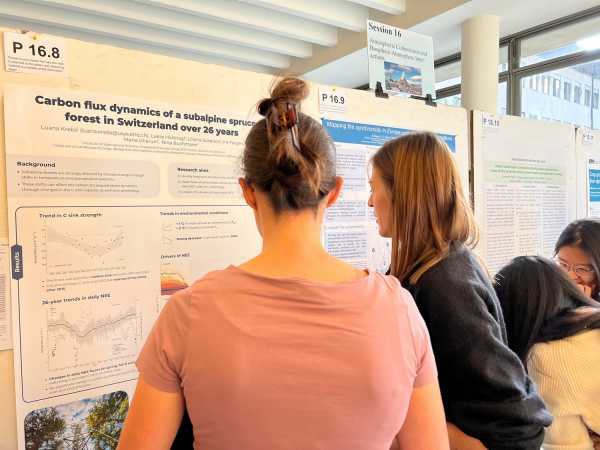 Woman explaining her poster to another woman