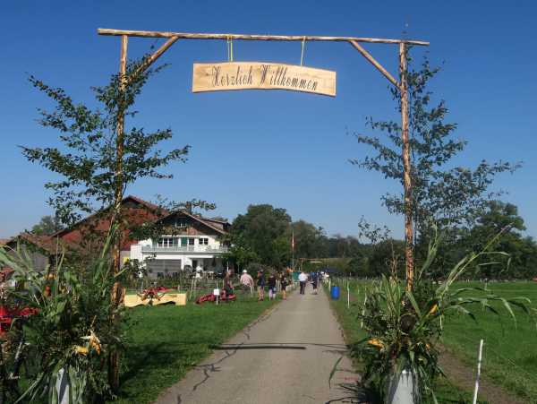 Welcome sign at farm entrance