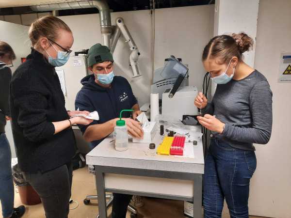 Students working with ball mill