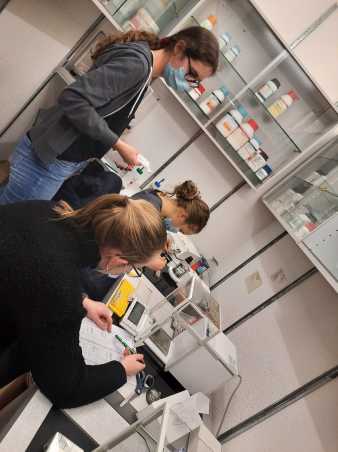 Students weighing samples