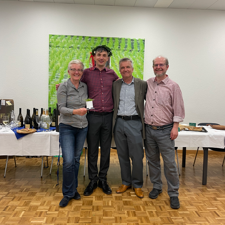 Doctoral student (with laurel wreath) and three committee members