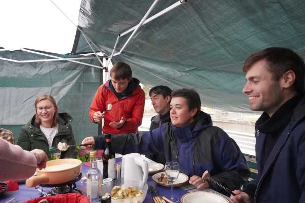 Enlarged view: People eating fondue
