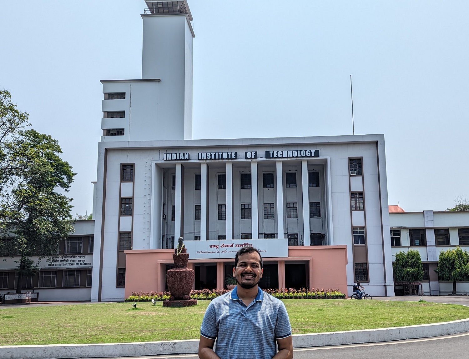 Person standing in front of the Indian Institute of Technology