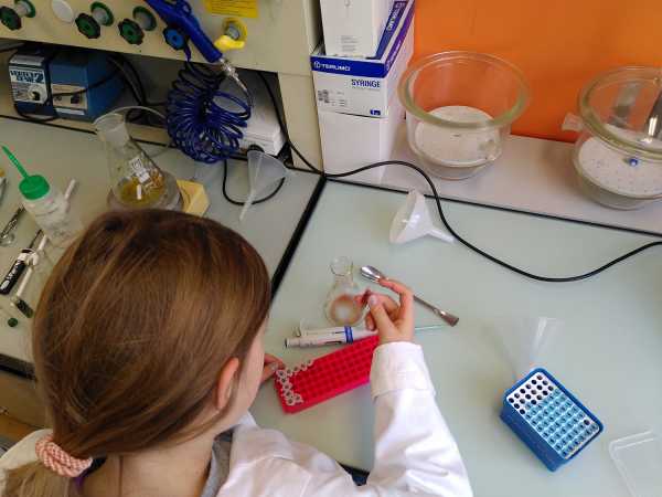 Girl looking at filled tubes