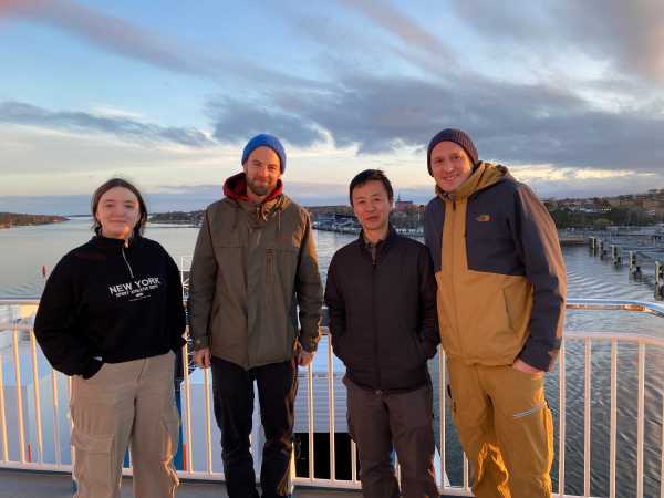 Four people on a ferry ship.