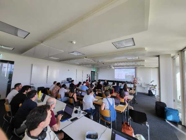 Woman teaching in front of full room